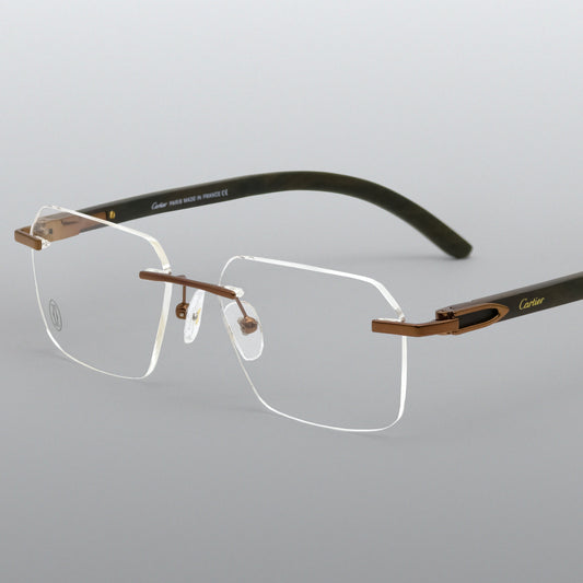 Pair of glasses with a gold frame on a light gray background