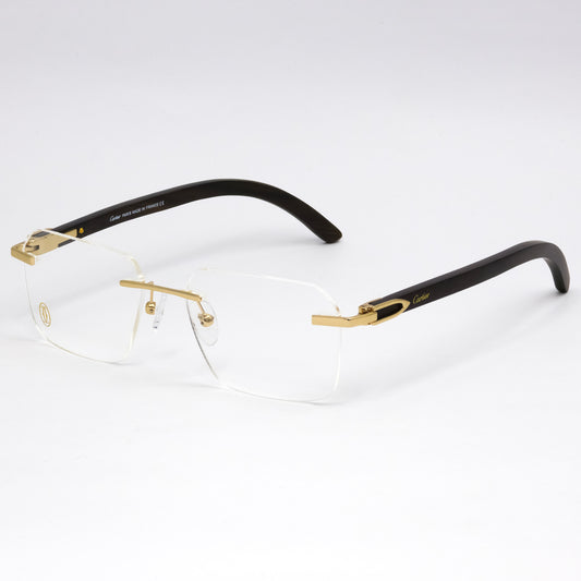 Gold and black rimless eyeglasses on a white background