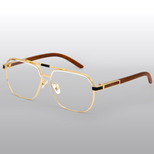Gold-framed eyeglasses with wooden accents on a light gray background