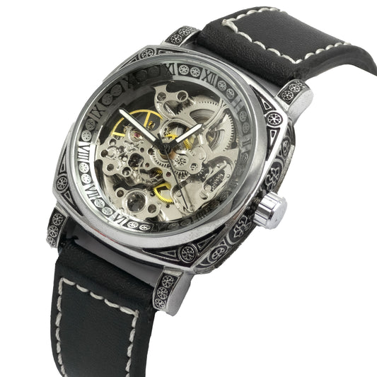 Mechanical watch with black leather strap on a white background
