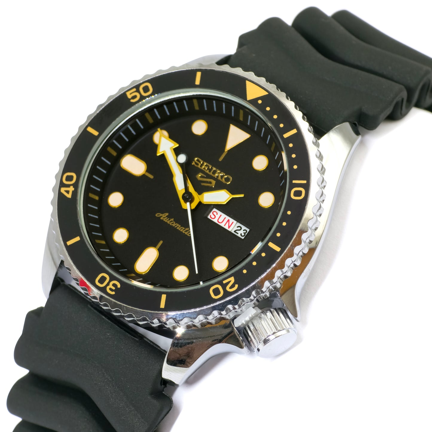 Seiko watch with black dial and rubber strap on a white background