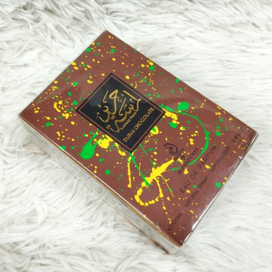 Chocolate bar with decorative packaging on a white textured surface
