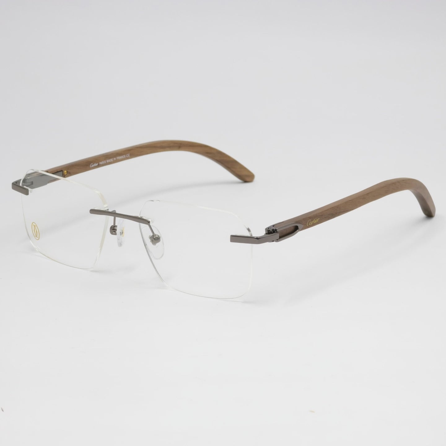 Eyeglasses with brown and gold frame on a white background
