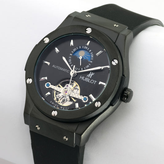 Black Hublot watch on a white background