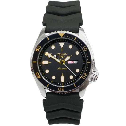 Seiko watch with black rubber strap on a white background