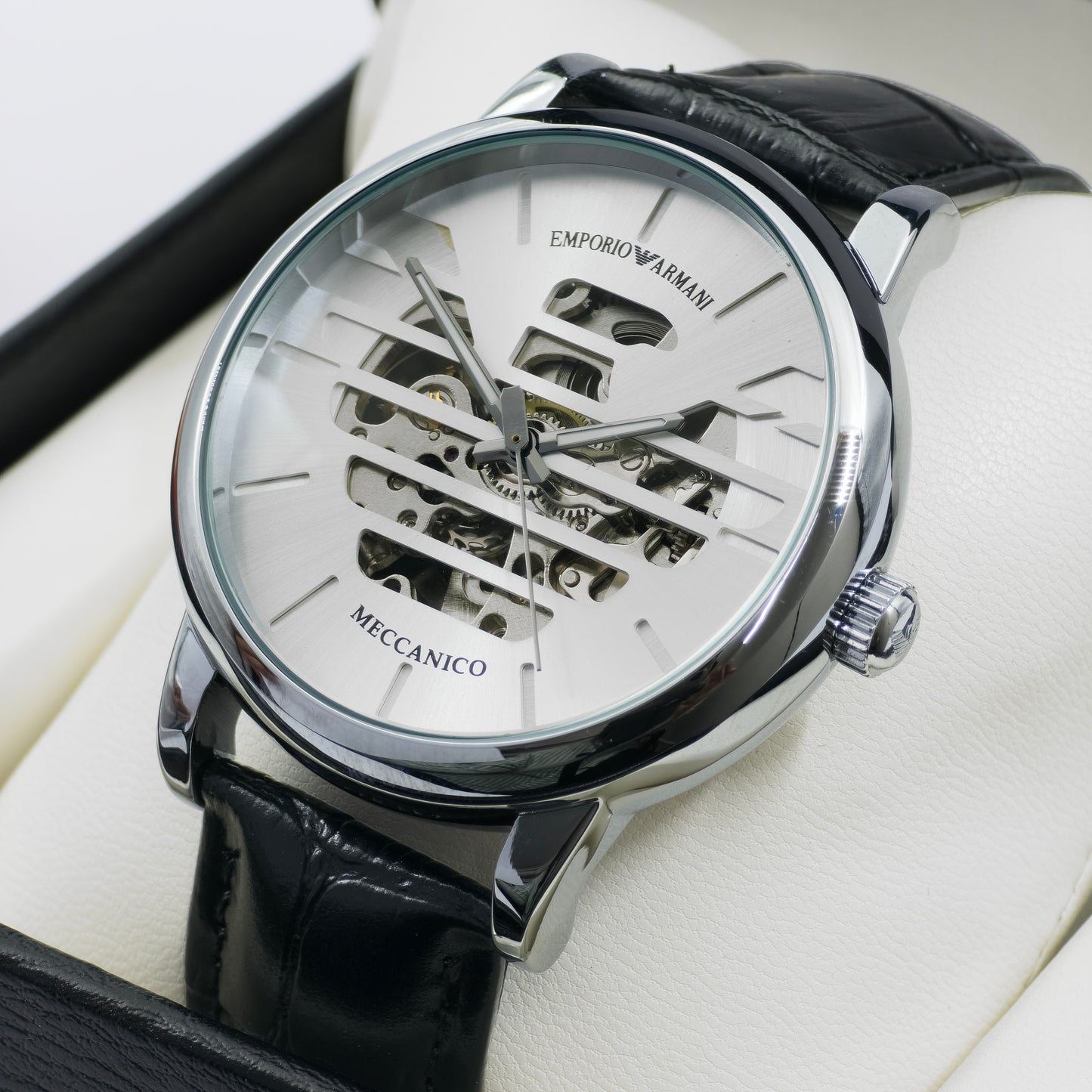 Emporio Armani watch with black leather strap on a white background