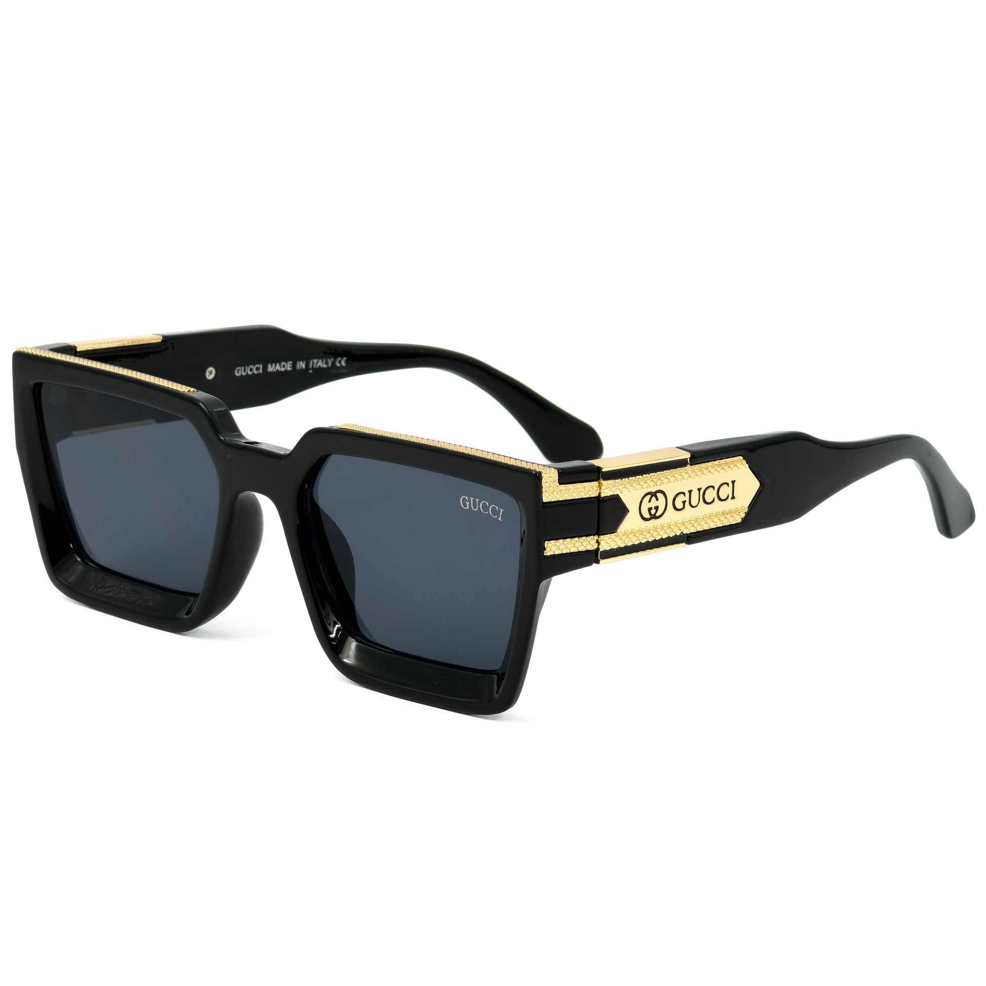 Black and gold Gucci sunglasses on a white background
