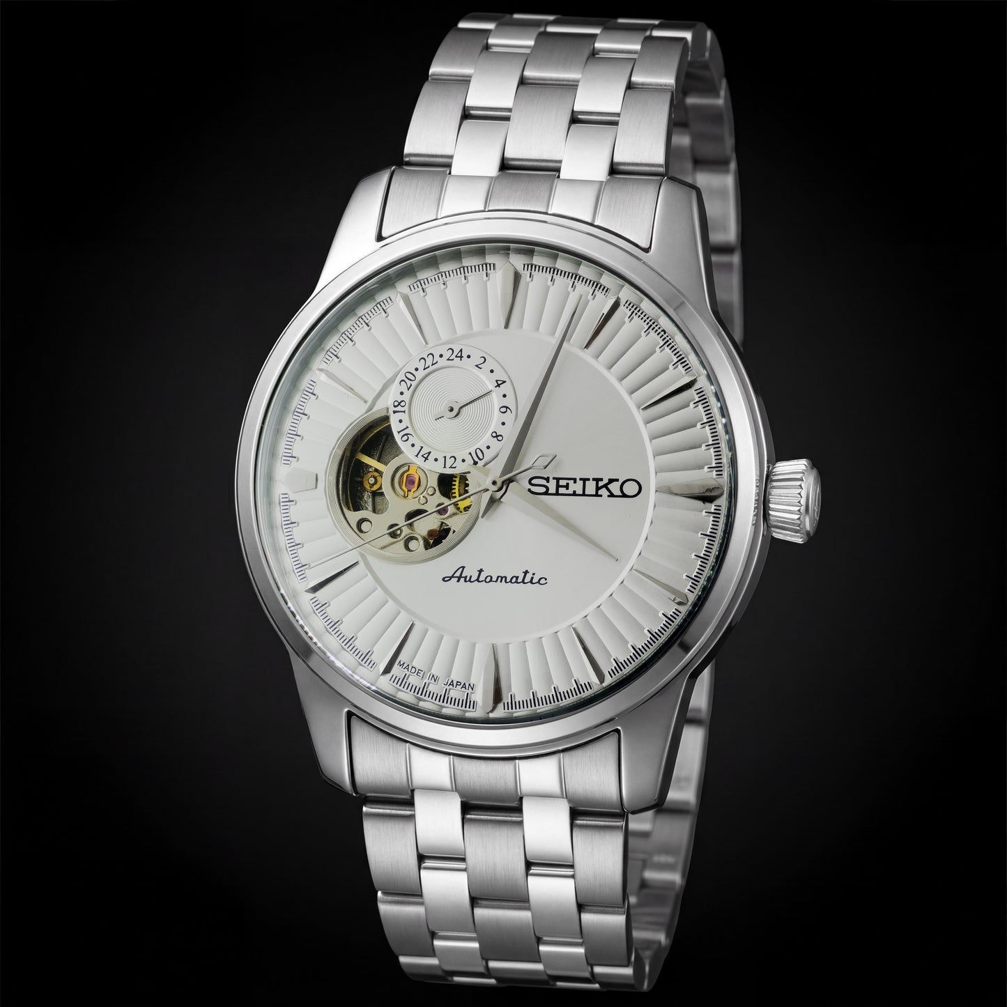 Silver Seiko watch with a black background