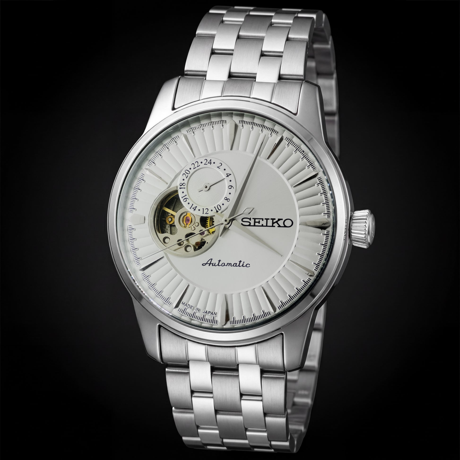 Silver Seiko watch with a black background