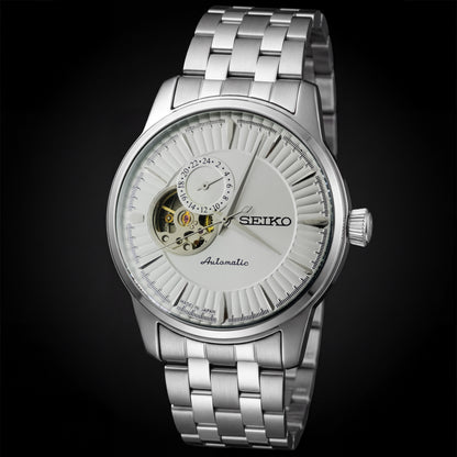 Silver Seiko watch with a black background