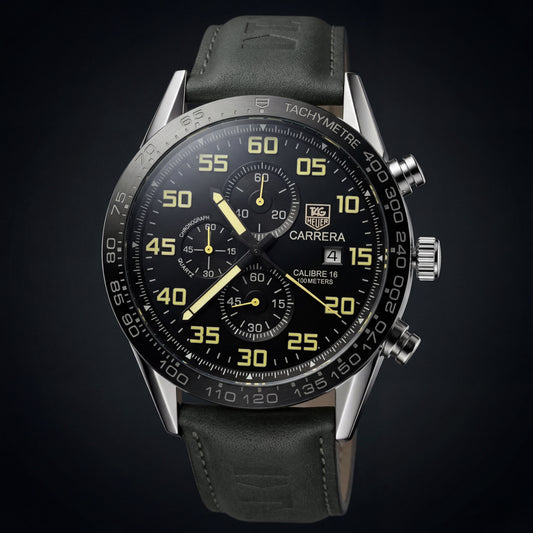 Tag Heuer Carrera watch with black dial and leather strap on a dark background