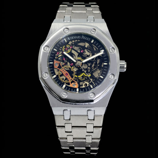 Silver watch with a detailed face on a black background