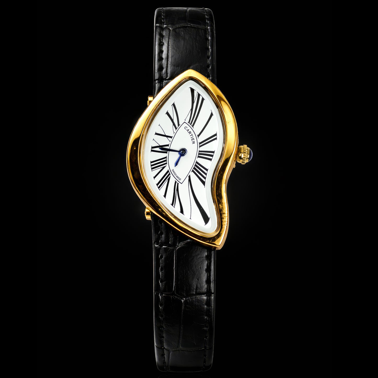 Gold-framed watch with black leather strap on a black background