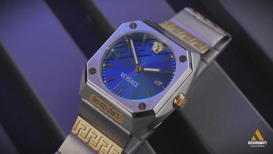 Versace watch with blue face and gold accents on a wooden surface