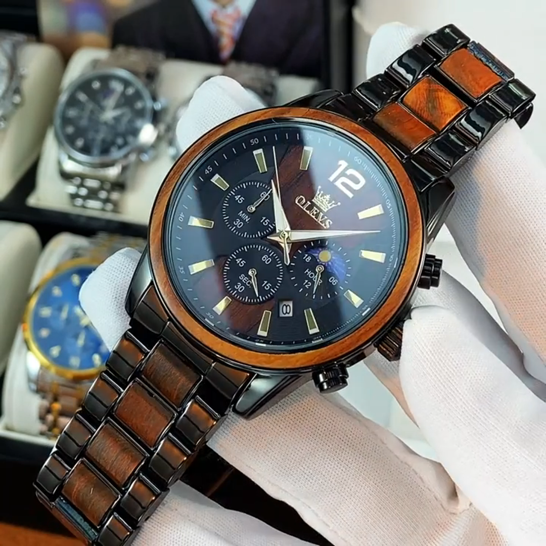 Luxury watch with wooden and metal strap on a wooden surface