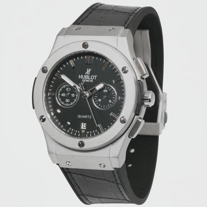 Hublot watch with black face and leather strap on a white background