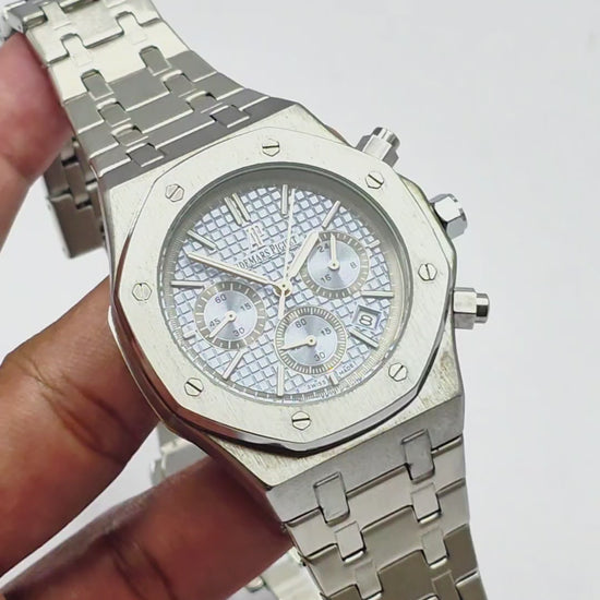 An Audemars Piguet quartz watch with a stainless steel band and a blue dial featuring multiple subdials and a date display.