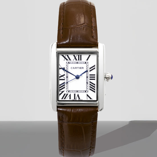 Cartier watch with brown leather strap on a white background