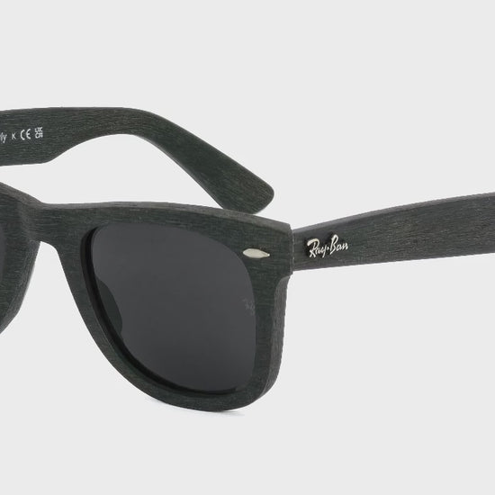 Black sunglasses with 'Ray-Ban' logo on a white background