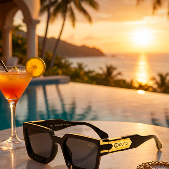 Black and gold Gucci sunglasses on a white background